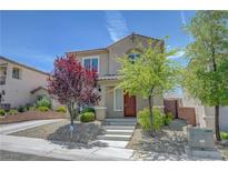 Inviting two-story home featuring a well-maintained landscaped front yard and charming curb appeal at 2641 Vendange Pl, Henderson, NV 89044