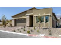 Charming single-story home with a two-car garage and desert landscaping for low maintenance at 12438 Heritage Bend Dr, Las Vegas, NV 89138