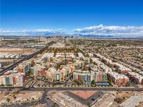 Stunning aerial view showcases the community's layout and proximity to city and mountain views at 50 E Serene Ave # 107, Las Vegas, NV 89123