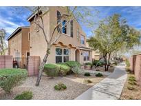 Charming two-story house featuring low-maintenance landscaping and a welcoming walkway at 11036 Mount Hunter St, Las Vegas, NV 89179