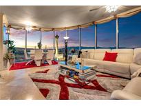 Bright living room with floor to ceiling windows showing a cityscape view and luxury finishes at 322 Karen Ave # 4207, Las Vegas, NV 89109