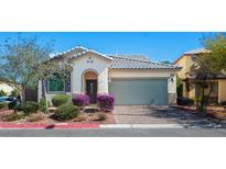 Charming single-story home with a two-car garage, landscaped front yard, and beautiful desert landscaping at 4032 Little Bay Ave, North Las Vegas, NV 89081