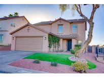Charming two-story home with a well-manicured lawn and inviting curb appeal at 189 Kings Canyon Court Ct, Henderson, NV 89012