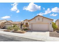 Charming single-story home showcasing desert landscaping and a two-car garage at 4416 Peaceful Morning Ln, Las Vegas, NV 89129