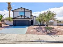 Charming two-story home featuring a well-maintained yard and a two-car garage at 6401 Goldmine Dr, Las Vegas, NV 89156