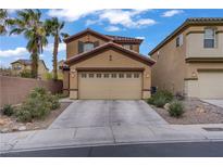 Two-story home boasts a front yard, spacious driveway, and attached two-car garage at 651 Penshaw Bridge Ave, Las Vegas, NV 89178