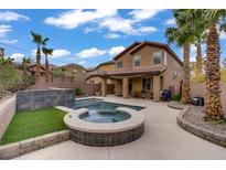 Resort-style backyard featuring a sparkling pool and spa, perfect for outdoor relaxation and entertaining at 651 Penshaw Bridge Ave, Las Vegas, NV 89178