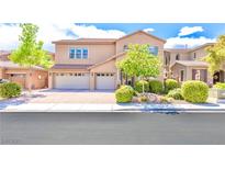 Charming two-story home featuring a three-car garage, complemented by a beautifully landscaped front yard and a well-maintained lawn at 6917 Puetollano Dr, North Las Vegas, NV 89084