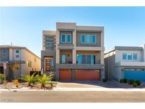 Modern two-story home featuring a two-car garage, balcony, and well-maintained landscaping at 8179 Shale Canyon St, Las Vegas, NV 89139