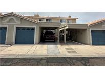 Townhouse with covered parking and garage door, showing unit number, offering convenience and shelter at 2282 Camel Mesa Dr, Laughlin, NV 89029