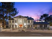 Elegant two-story home with a grand entrance and well-maintained landscaping at 3010 La Mesa Dr, Henderson, NV 89014