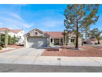 Charming single story home featuring a tile roof and well maintained front yard at 8500 Gull Dr, Las Vegas, NV 89134