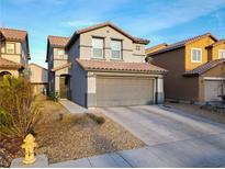 Charming two-story home features a neutral exterior, well-kept landscaping, and an attached two-car garage at 8532 Caddy Corner St, Las Vegas, NV 89139
