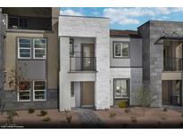 Modern three-story townhome featuring stone accents, private balconies, and a well-maintained front yard at 890 Apatite Pl # Lot 68, Henderson, NV 89011