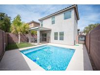 Inviting backyard pool area, perfect for relaxation and entertaining with desert landscaping and patio area at 9277 Valley Ranch Ave, Las Vegas, NV 89178