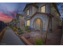 Charming two-story home with landscaped front yard and inviting covered entry at 10650 Sariah Skye Ave, Las Vegas, NV 89166