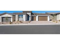 Attractive single-story home with a two-car garage and stone details on the facade at 352 Tigullio Ave, Henderson, NV 89011
