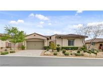 Charming single-story home with a two-car garage and beautiful desert landscaping at 730 Puerto Real Ct, Las Vegas, NV 89138