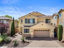 Charming two-story home with a desert-landscaped front yard and a two-car garage at 10437 Walworth Ave, Las Vegas, NV 89166