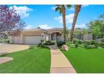 Inviting single-story home featuring desert landscaping, a three-car garage, and a tile roof at 4722 Blue Mesa Way, Las Vegas, NV 89129