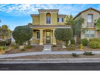 Inviting two-story home with a well-manicured front yard and charming architectural details at 2020 Self Portrait St, Henderson, NV 89044