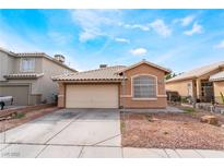 Charming single-story home with a two-car garage and well-maintained front yard at 6149 Elderberry Wine Ave, Las Vegas, NV 89142
