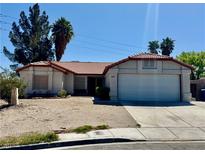 Charming single-story home with desert landscaping and a two-car garage on a sunny day at 8072 Hackberry Dr, Las Vegas, NV 89123
