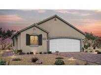Charming single-story home featuring a neutral color palette, a two-car garage, and thoughtfully landscaped desert-friendly front yard at 90 Sonata Dawn Ave, Henderson, NV 89011