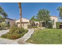 Charming single-story home features a well-manicured lawn, desert landscaping, and inviting entrance at 11540 Snow Creek Ave, Las Vegas, NV 89135