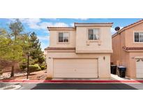 Inviting two-story home with a two-car garage and well-maintained landscaping at 3103 Sunrise Cove Ave, North Las Vegas, NV 89031