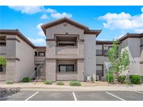 Attractive condo featuring a private balcony and staircase access in a well-maintained community with ample parking at 45 Maleena Mesa St # 1113, Henderson, NV 89074