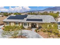 Charming single-story home featuring desert landscaping and solar panels at 5892 Castleberry Peak Ave, Las Vegas, NV 89131