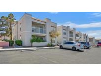 Inviting exterior of multi-Gathering apartment building with private balconies and ample parking at 6800 E Lake Mead Blvd # 2050, Las Vegas, NV 89156