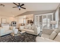 Bright living room with neutral walls, a ceiling fan, and large windows, perfect for entertaining at 7250 Diamond Canyon Ln # 204, Las Vegas, NV 89149