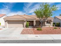 Charming single-story home with a well-manicured front yard and a spacious two-car garage at 8812 Marble Dr, Las Vegas, NV 89134