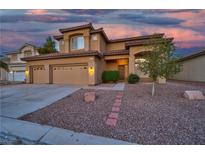 Charming two-story home with a three car garage, landscaped yard, and a warm inviting entrance at 8944 Campanella St, Las Vegas, NV 89123