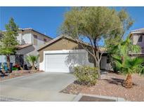Charming single Gathering home with a well-maintained front yard and a two-car garage in a suburban neighborhood at 5438 Jacobs Field St, Las Vegas, NV 89148