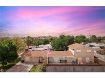 Charming single-story home with a well-maintained yard, a fenced backyard and an American flag at 1200 I Ave, Boulder City, NV 89005