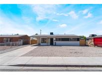 Charming single-story home featuring freshly painted exterior and well-maintained landscaping at 1648 J St, Las Vegas, NV 89106