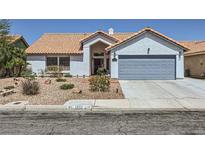 Charming single-story home with desert landscaping, tile roof and two-car garage at 1698 Laurel Oak Dr, Las Vegas, NV 89123