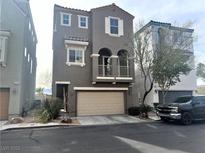 Attractive two-story home features a balcony, a two-car garage, and desert landscaping at 9535 Leaping Lizard St, Las Vegas, NV 89178