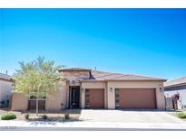 Charming single-story home with a two-car garage, desert landscaping, and a stone accent facade at 2719 Canvas Sky St, Henderson, NV 89044