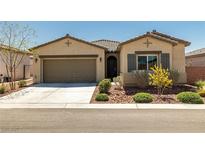Charming single-story home with a two-car garage and desert landscaping, perfect for low-maintenance living at 5635 E La Campana Dr, Pahrump, NV 89061