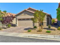 Charming single-story home with a two-car garage and well-maintained desert landscaping at 8036 Literature Ct, Las Vegas, NV 89113