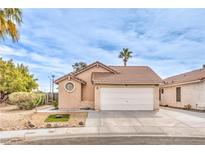 Charming single-story home featuring a 2-car garage and a well-maintained front yard landscape at 2744 Ironside Dr, Las Vegas, NV 89108