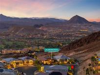 Stunning aerial view of a luxury home showcasing mountain views in the upscale community at 35 Via Rizzuto, Henderson, NV 89011