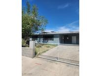 Charming single story home features a landscaped yard and a concrete driveway at 4536 Payson Ave, Las Vegas, NV 89115