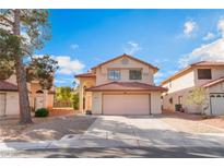 Charming two-story home featuring desert landscaping and a two-car garage in a residential neighborhood at 4817 Friar Ln, Las Vegas, NV 89130
