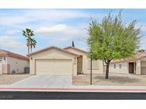 Charming single-story home with a well-maintained yard and desert landscaping at 4920 River Splash Ave, Las Vegas, NV 89131