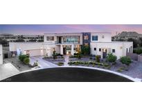 Contemporary home featuring a manicured front yard and a multi-car garage at 9780 Solar Ave, Las Vegas, NV 89149